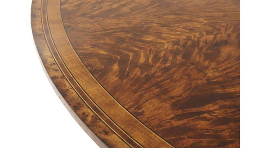 Dining Tables Circular extending mahogany dining table.