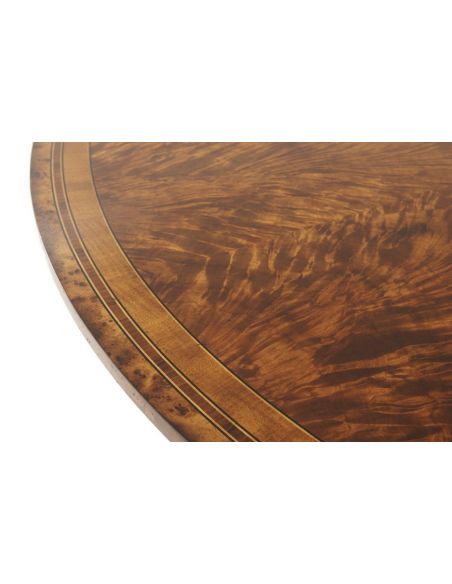 Dining Tables Circular extending mahogany dining table.