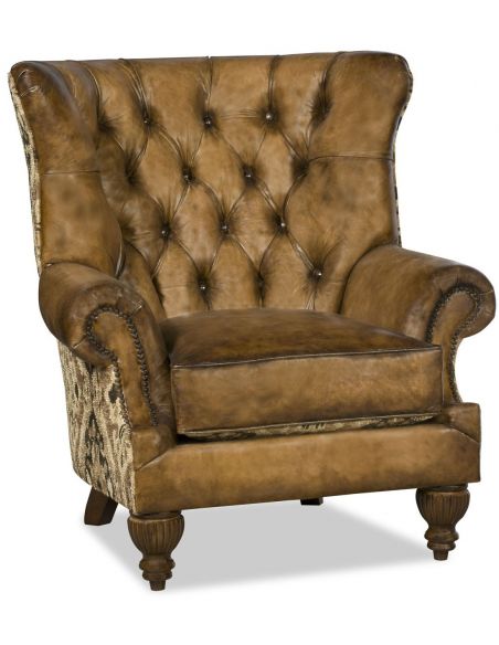 Luxurious leather wing backed chair with tufted back