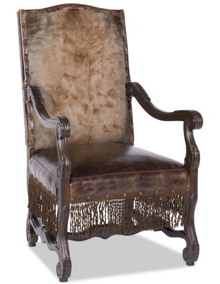 Armchair with hand carved wooden details with fringe