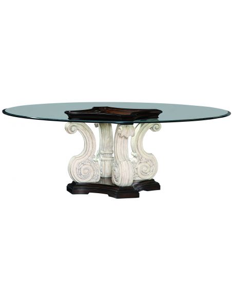 Glass topped dining table with scrolled pedestal base