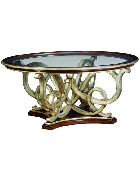 Glass topped dining table with intricate hand carved base.