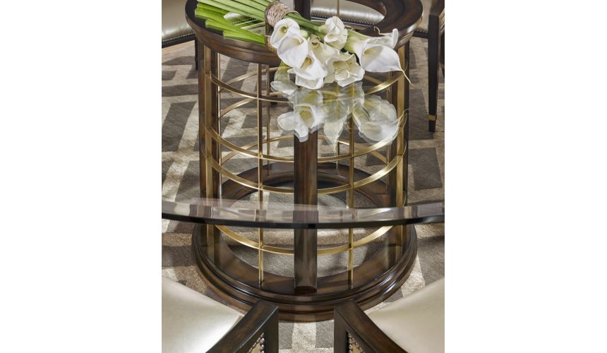 Dining Tables Glass topped dinning table with pedestal base.