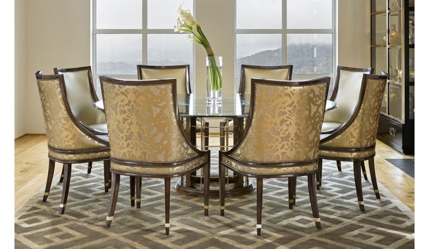 Dining Tables Glass topped dinning table with pedestal base.