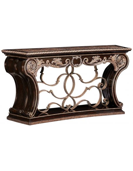 Wooden console table with intricate scroll work.