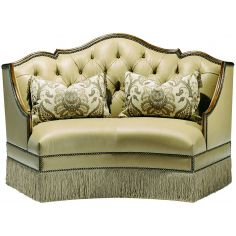 SETTEES, CHAISE, BENCHES Leather settee with wood trim and chic fringed skirt