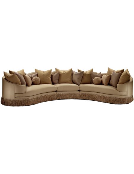 Cream colored sofa with luxurious fabric and fringed skirt