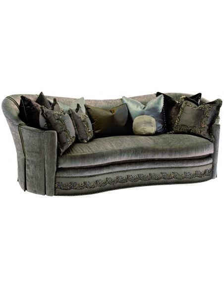 Dove grey sofa with elegant curved back and intricate trim