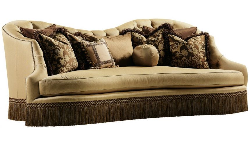 SOFA, COUCH & LOVESEAT Bisque colored sofa with beautiful curved lines and fringed skirt