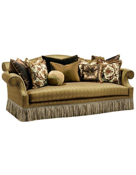 Rolled back sofa with a chic fringed skirt