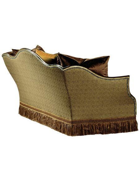 SOFA, COUCH & LOVESEAT Sofa covered in warm earth toned fabrics with hand carved wooden accents