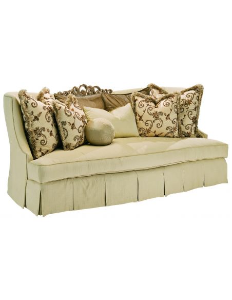 Sofa in a lux cream fabric with hand carved wooden details