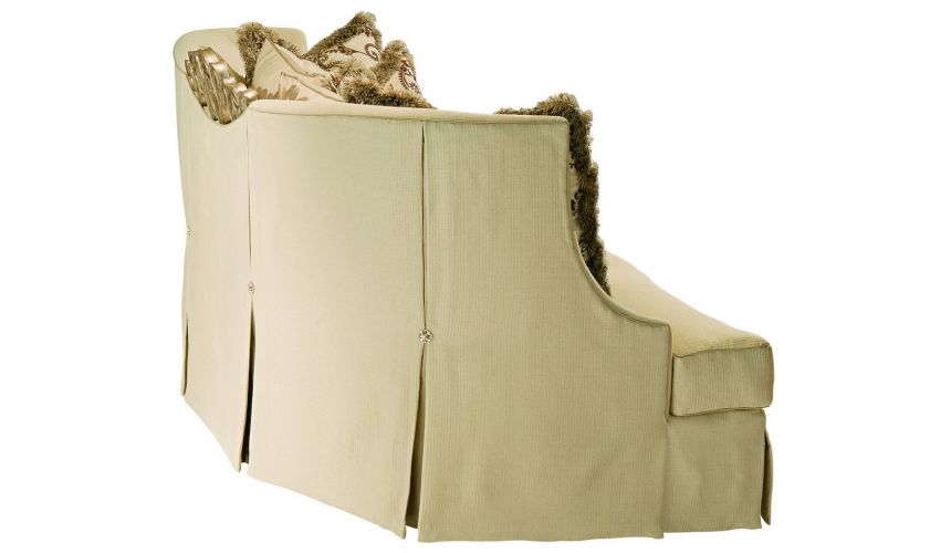 SOFA, COUCH & LOVESEAT Sofa in a lux cream fabric with hand carved wooden details