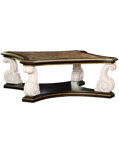 Cocktail table with intricately carved scrolled legs