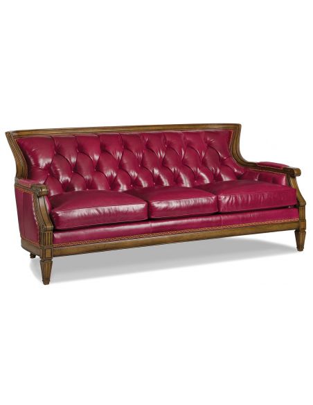 Red leather tufted sofa