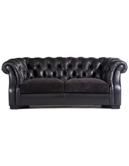 Tufted black leather sofa