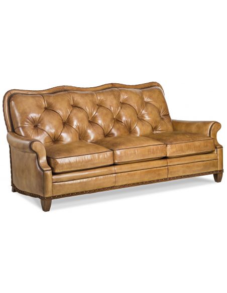 Tufted brown leather sofa