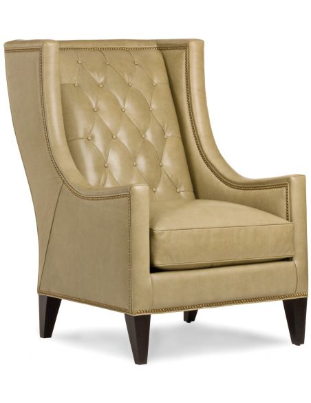 Cream tufted wing backed chair