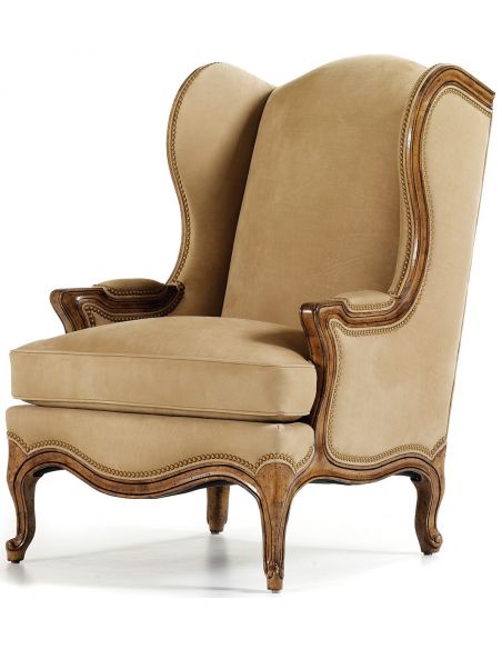 Beige wing backed chair