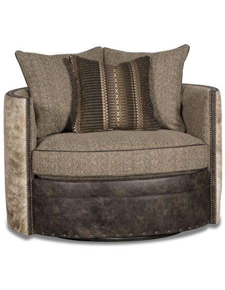Barrel style chair covered in leather, herringbone, and animal print