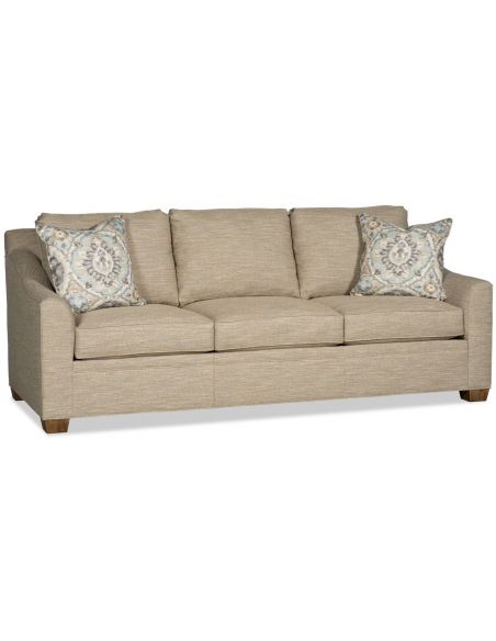 Sofa covered in a textured oatmeal colored fabric