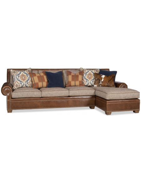 Sectional sofa covered in a combination of leather and fabric