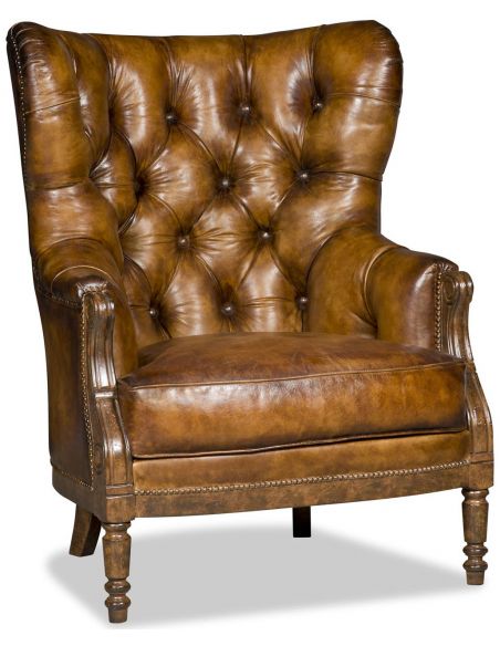 Leather armchair with tufted back