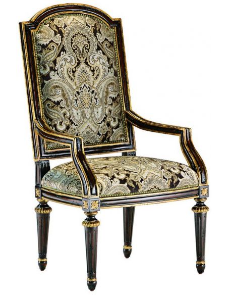 Dining room chair with arms covered in printed fabric with carved wooden legs
