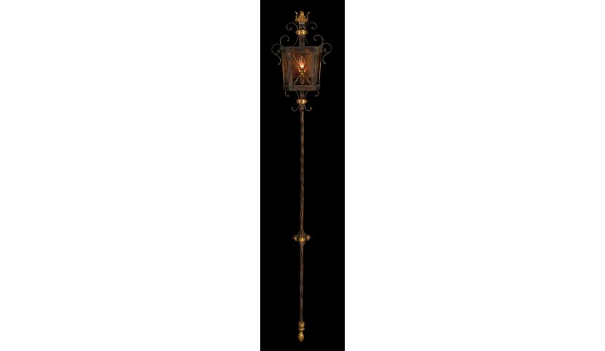 Lighting Sconce in antiqued finish with gold leaf accents. Features open cage