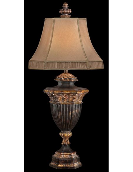 Table lamp in warm finish with gold leaf accents