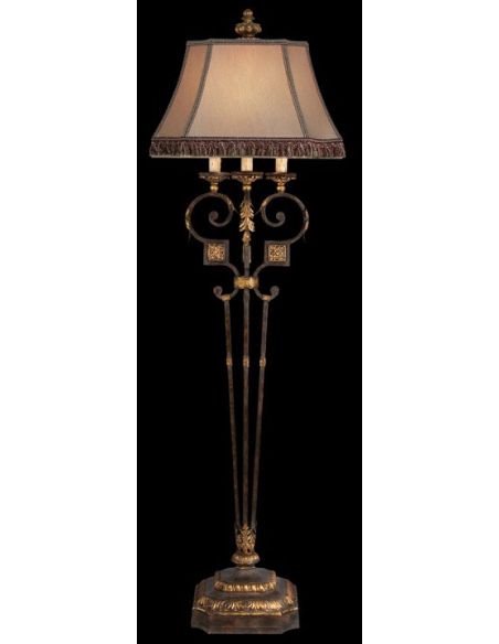 Floor lamp of antiqued iron and warm gold leaf finish