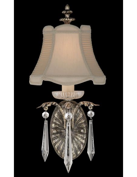 Wall sconce of steel in warm antiqued silver finish with brilliant crystal drops