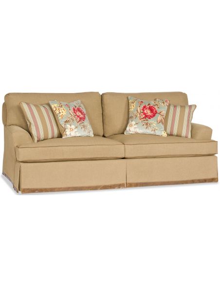 Tan Sofa with Floral pillow