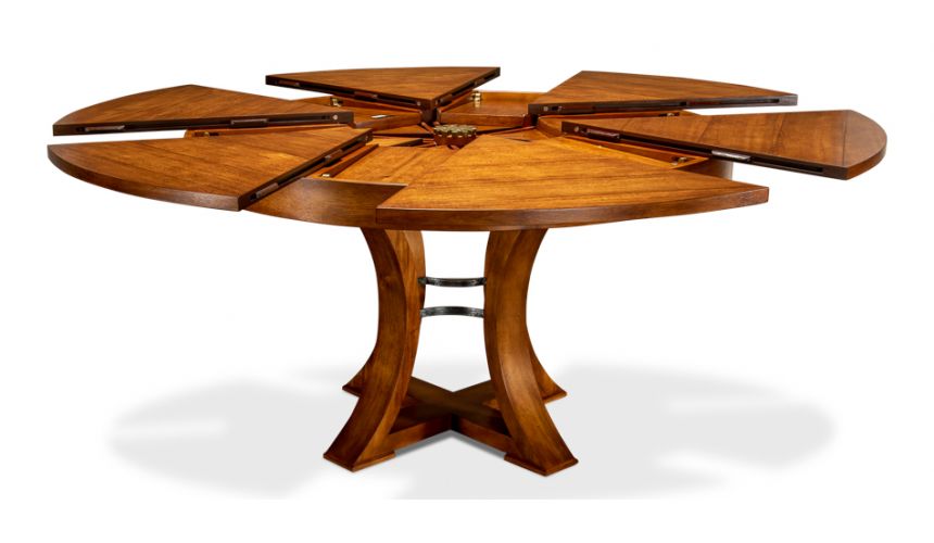 Transitional style round table with self storing leaves.