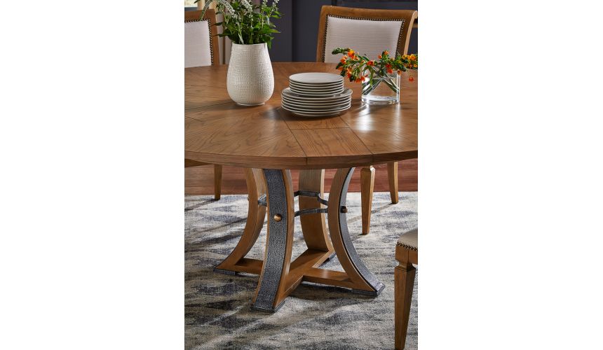 70-inch Round dining table with self-storing leaves. Heather gray stain