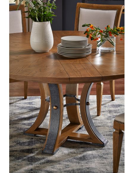 70-inch Round dining table with self-storing leaves. Heather gray stain