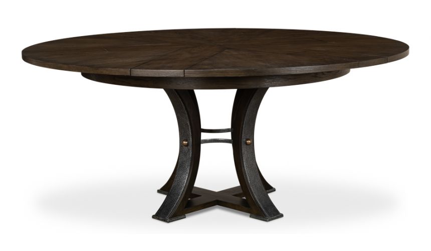 70-inch round table with self-storing leaves. Dark finish on oak wood