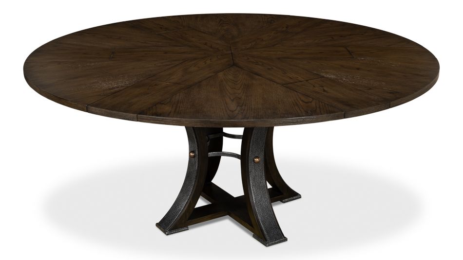 70 Round table with self-storing leaves. Dark finish on oak wood