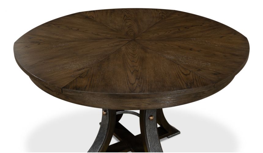70-inch round table with self-storing leaves. Dark finish on oak wood
