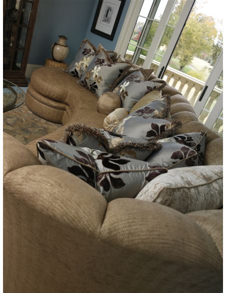 Sectional with curved lines and coordinating accent pillows