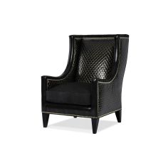 Stylish modern armchair covered in a mix of animal print fabrics and embossed leathers 2
