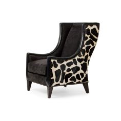 Stylish modern armchair covered in a mix of animal print fabrics and embossed leathers