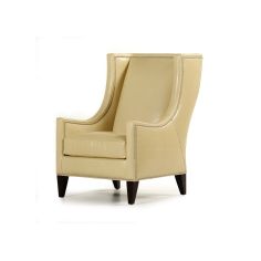 Stylish modern armchair covered in a mix of animal print fabrics and embossed leathers 2