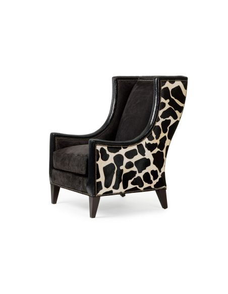 Stylish modern armchair covered in a mix of animal print fabrics and embossed leathers