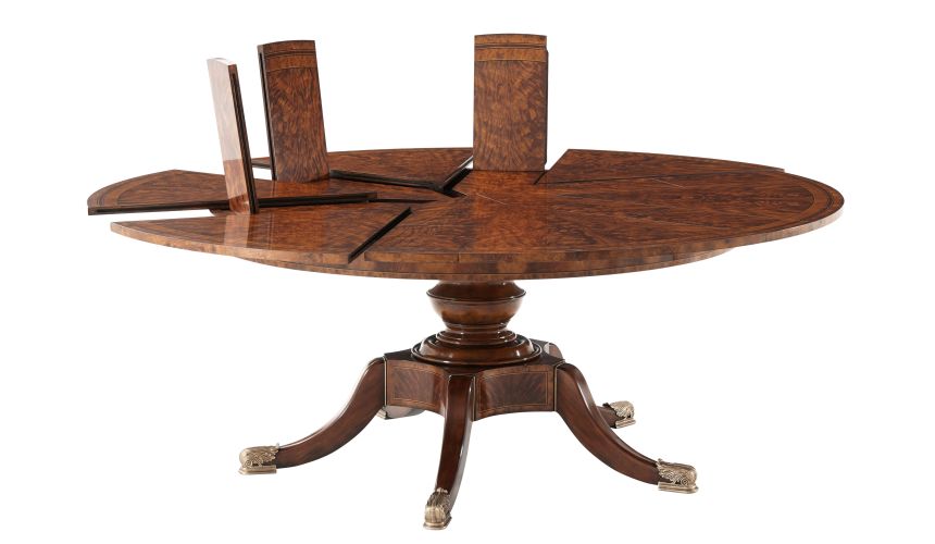 Circular extending mahogany dining table.