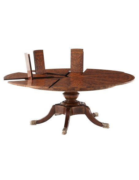 Circular extending mahogany dining table.