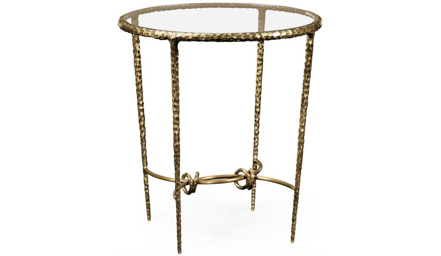 Patinated finish hammered brass circular side table.
