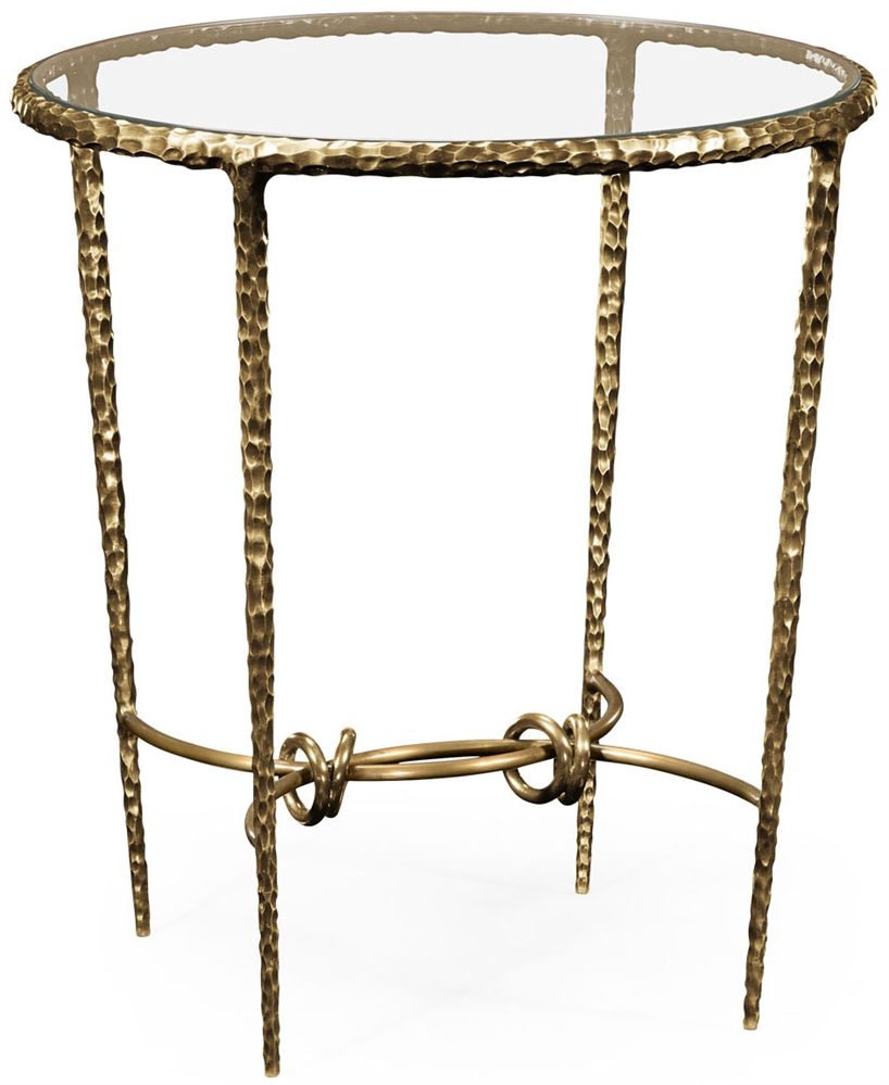 Patinated finish hammered brass circular side table.