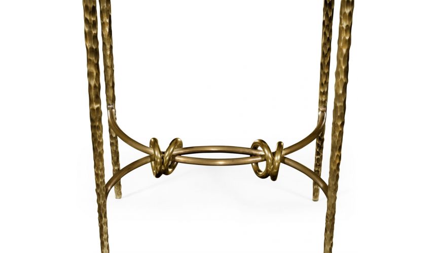 Patinated finish hammered brass circular side table.