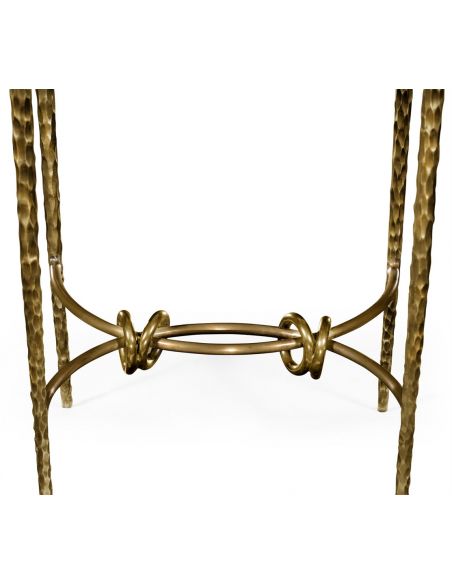 Patinated finish hammered brass circular side table.